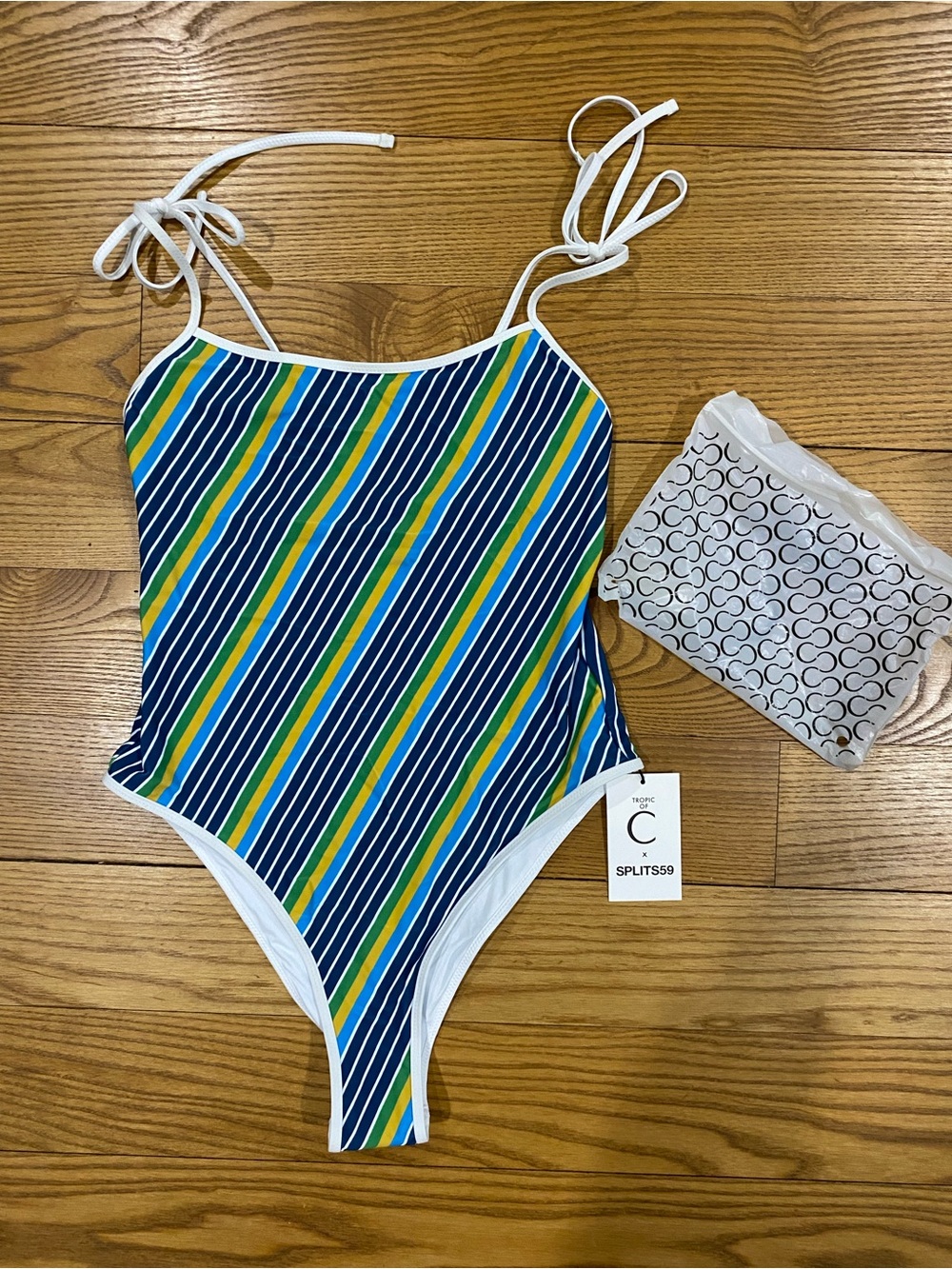 Tropic of C striped one piece. NWT. Size medium.